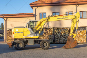 Колісний екскаватор New Holland E145D 2003 р. 