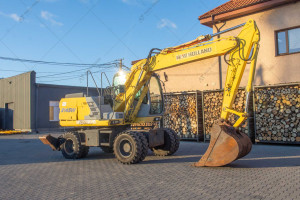 Колісний екскаватор New Holland E145D 2003 р. 