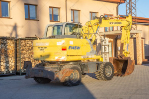 Колісний екскаватор New Holland E145D 2003 р. 