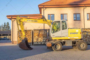 Колісний екскаватор New Holland E145D 2003 р. 
